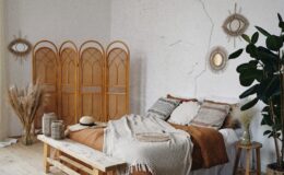 brown wooden door near brown woven armchair